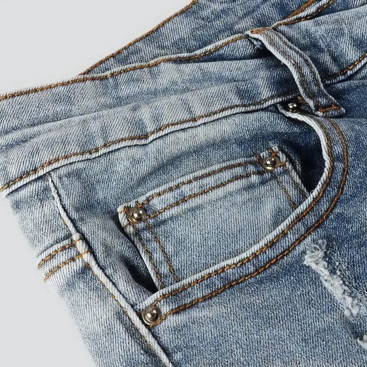 Black-patch whiskered jeans